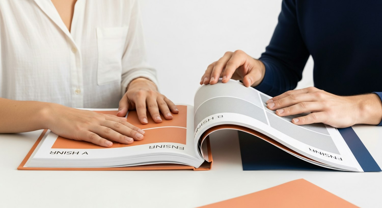 A review of printed work laid out on the studio table